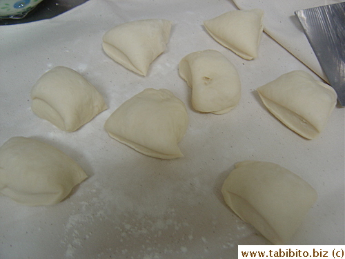 The dough is slightly punched out and divided into eighths