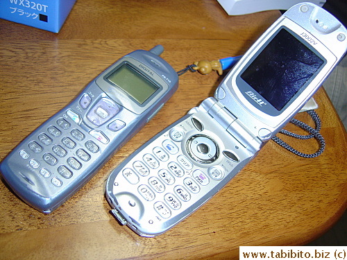 Our old phones, the dated one on the left is mine