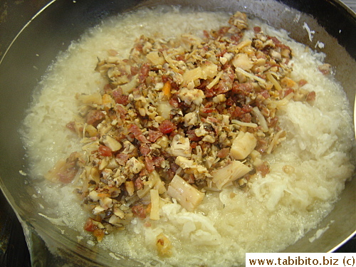 The filling goes back to the wok to join the daikon