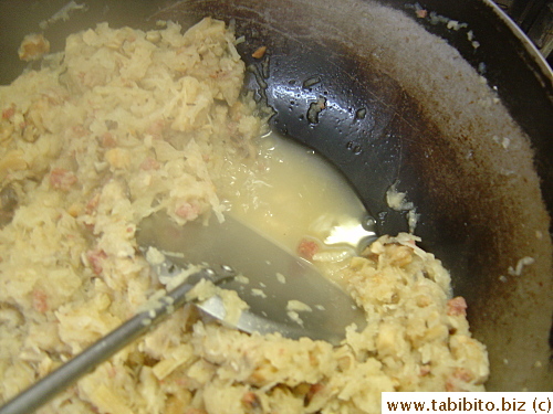 Till the liquid is almost gone before the flour mixture goes in
