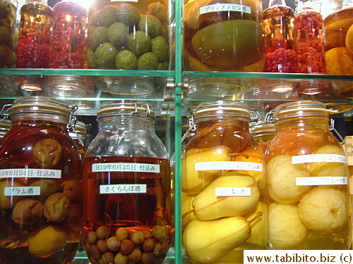 A lot of house made liquor with mecerated fruits