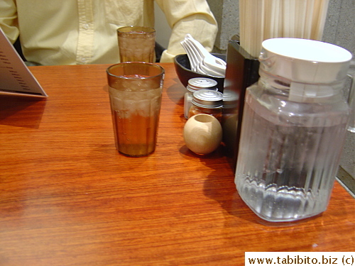 Extra spoons and a jug of iced water are on every table and counter