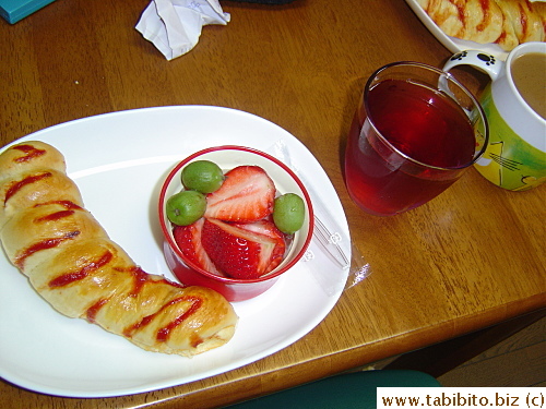 Day 2 brekkie: sausage roll and fruits