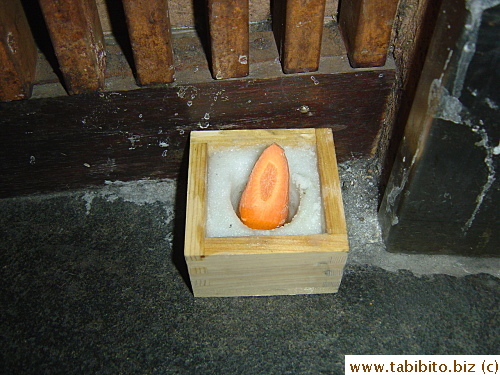 Salt and carrot in front of the lift to bring good luck and ward off evil