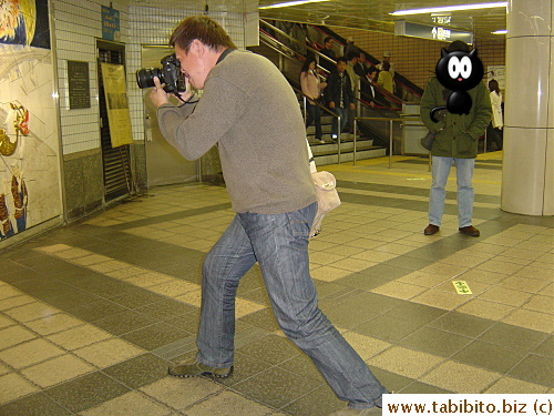 David strikes a photographer stance
