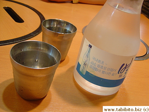 Water comes in a bottle and served in chilled stainless steel cups