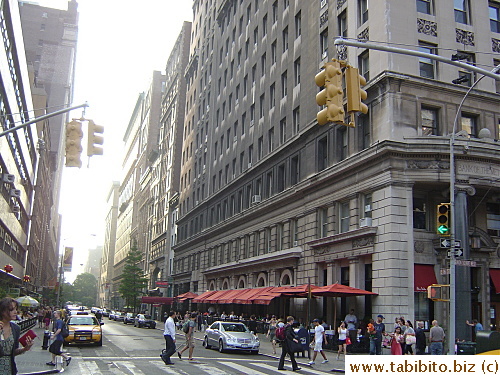 Union Square Cafe is on the right side of this street (the one with the red awning)