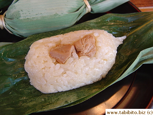 Two cubes of chicken in it.  The rice aroma reminds me of zongzi, just not as strong