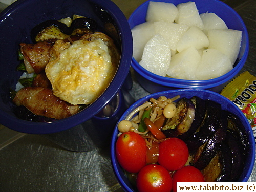 Rice, pork and asparagus rolls, fried quail egg, stirfried enoki and peppers, fried eggplant, cherry tomatoes, nashi