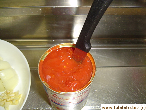 I usually cut the tomatoes directly in the can
