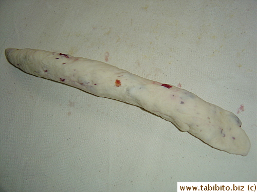 to form a log with one end flattened to wrap around the other end