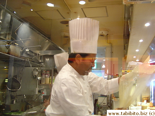 This chef loves to perform his dough twirling skill for passersby