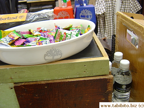 This Timberland store in Takashimaya serves browsing customers water and candies