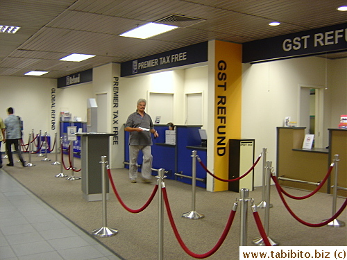 After immigration, there's this GST refund booth with no line for people like us with carry-on refund items 