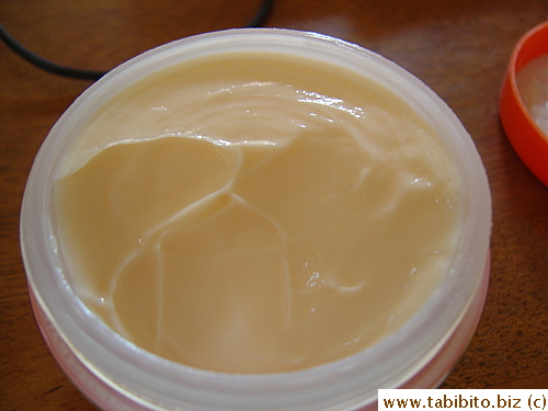 Looks like apricot sorbet.  It's very soft and easy to apply and yes, moisturizes dry skin beautifully