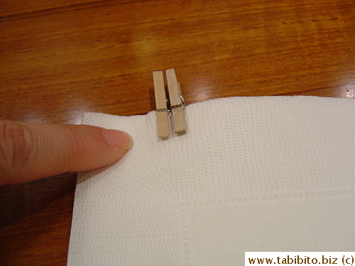 The paper napkin came with two cute little pegs