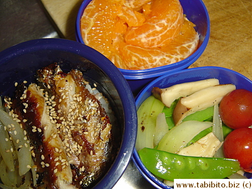 Grilled saury (sanma), stirfried onion, snow peas, and eringi mushrooms, cherry tomatoes, mandarin