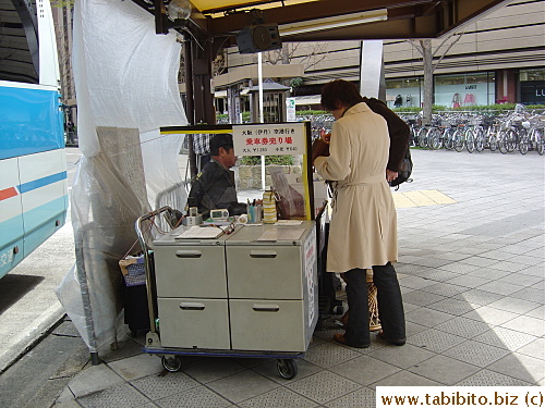 KL getting tickets for the bus to Itami airport