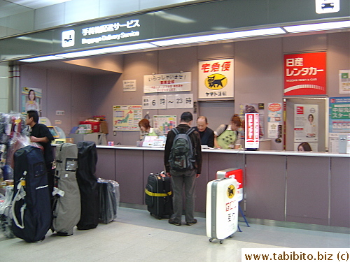 Giving our suitcase to Yamato to deliver it for us at Haneda Airport
