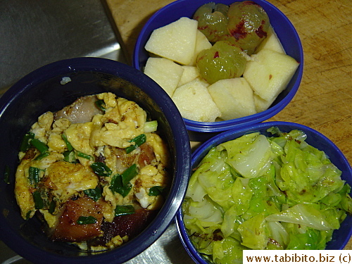 Stirfried charsui with egg and scallions, sauteed cabbage, apple and grapes