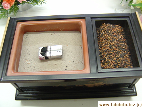 The stuff on the right gives off very fragrant smoke when it hits the coal (?) on the left