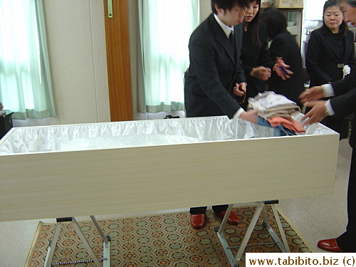 Ishida-san's clothing and trinkets were added to the casket