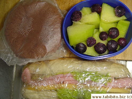 Ham and cheese sandwich, chocolate sponge cake, melon and blueberries