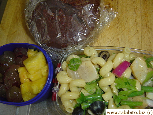 Scallop pasta salad, chocolate cake, pineapple and grapes