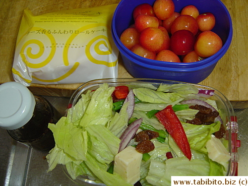 Garden salad with cheese, Japanese cherries, swiss roll