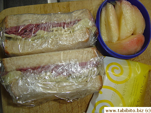 Pastrami and cheese sandwich, peach, cake