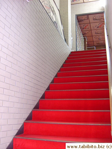 Carpeted stairs to the second floor