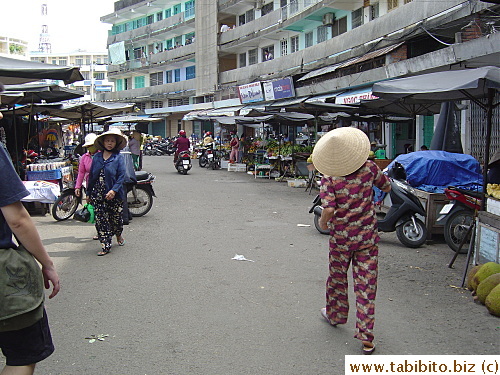 Outside the market is the fruit and flower stalls