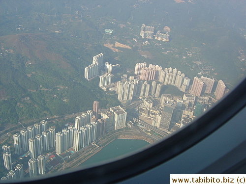 Approaching HK airport over high-rise apartment buildings