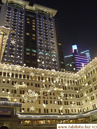 Peninsular Hotel and Hyatt behind the building in the right side of the photo