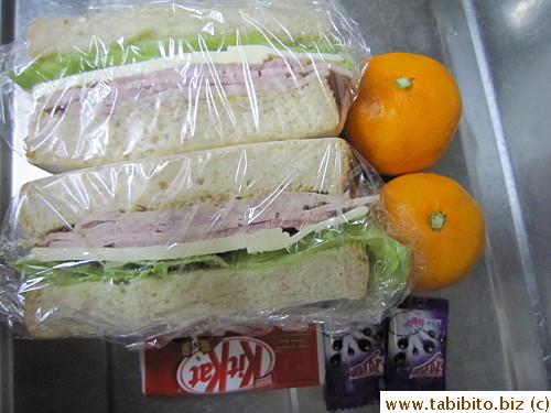 Ham, cheese and lettuce sandwich, mandarin, KitKat, Ribena candies