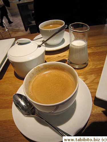Coffee is served in a handle-less cup