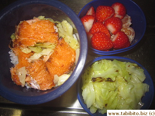 Grilled salmon, sauteed cabbage, strawberries and mandarin