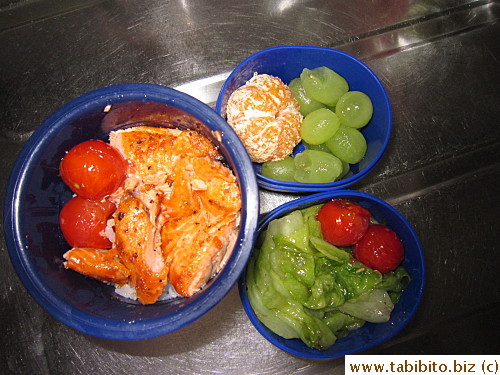 Grilled salmon, sauteed lettuce, seared cherry tomatoes, mandarin and grapes