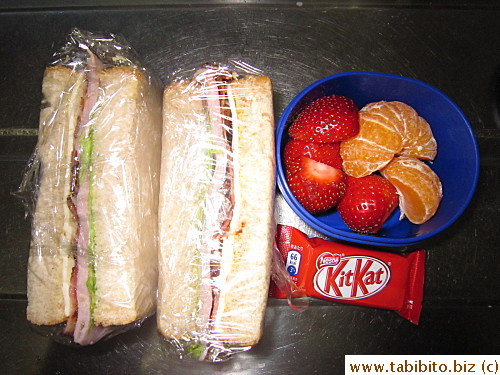Ham/bacon/cheese sandwich, KitKat, strawberries and mandarin