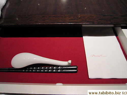 Utensils and napkin are stored in the table drawer