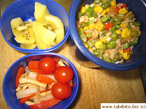Stirfried ground pork with mixed vegetables, stirfried celery, red peppers and eringi mushrooms, cherry tomatoes, kiwi