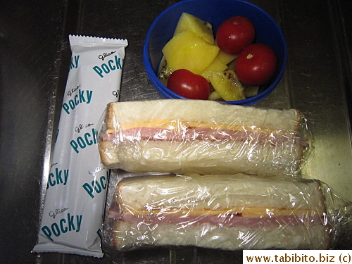 Ham and cheese sandwich, kiwi and cherry tomatoes, Pocky