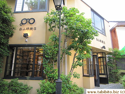 An eyeglass store (opposite Lupicia Tea Shop)