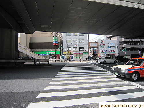 walk to the end to this intersection. Cross it, turn left and the store is soon on the right