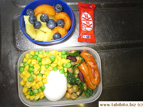 Veggies, beans, soft-boiled egg, sausages; kiwi, biwa and blueberries, KitKat 