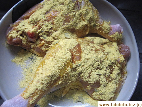 Seasoning mix is sprinkled on the chicken