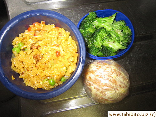 Paella, garlic broccoli, orange