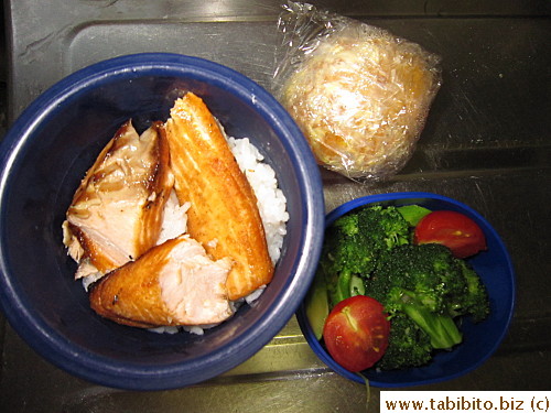 Grilled salmon, garlic broccoli, cherry tomatoes, orange