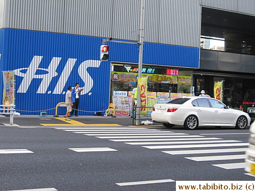 H.I.S  is opposite to Takashimaya Department Store in Shinjuku