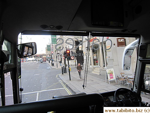 KL walks toward the bus after using the bathroom